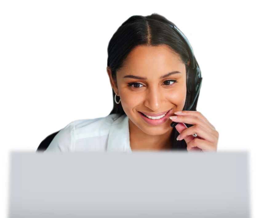 Woman talking into headset with a computer in front of her.